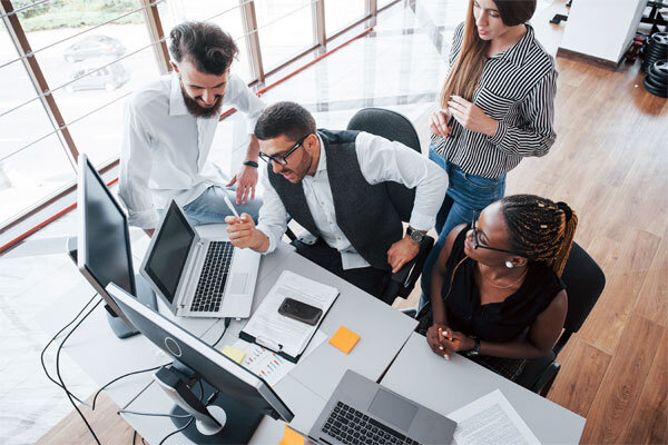 Image of an insurance agency team considering a full website redesign
